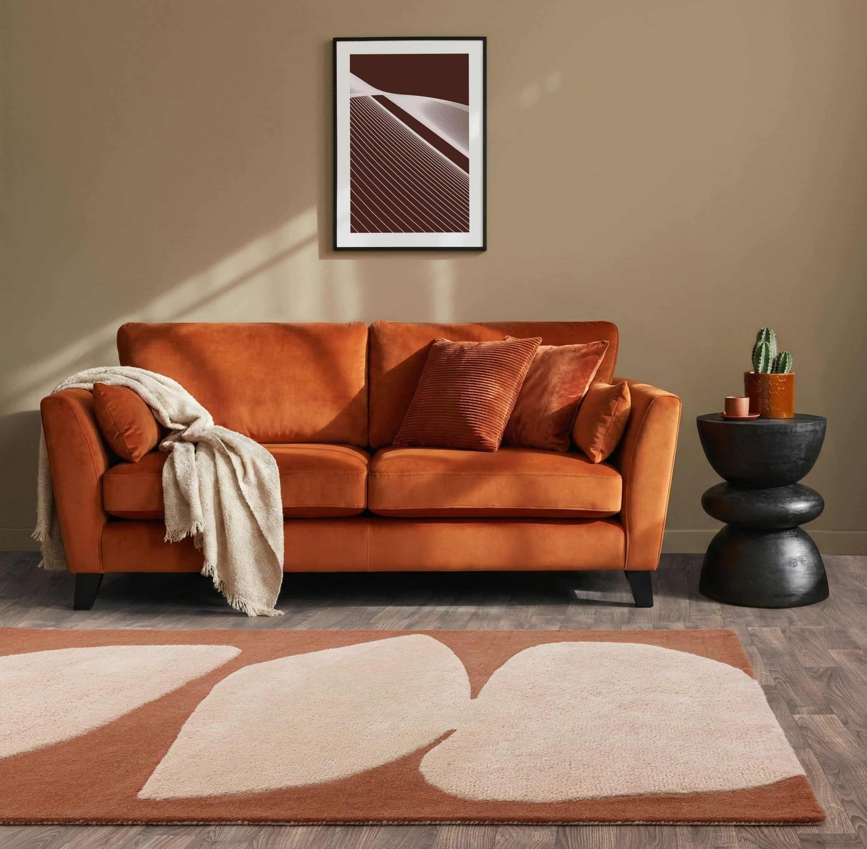 Retro rugs Orange sofa and rug in a living room