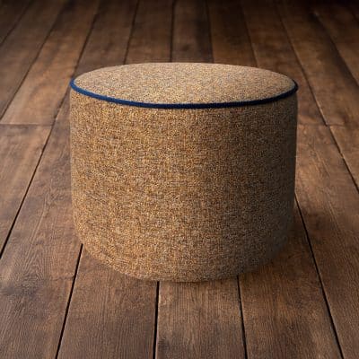 Ochre linen stool on floorboards