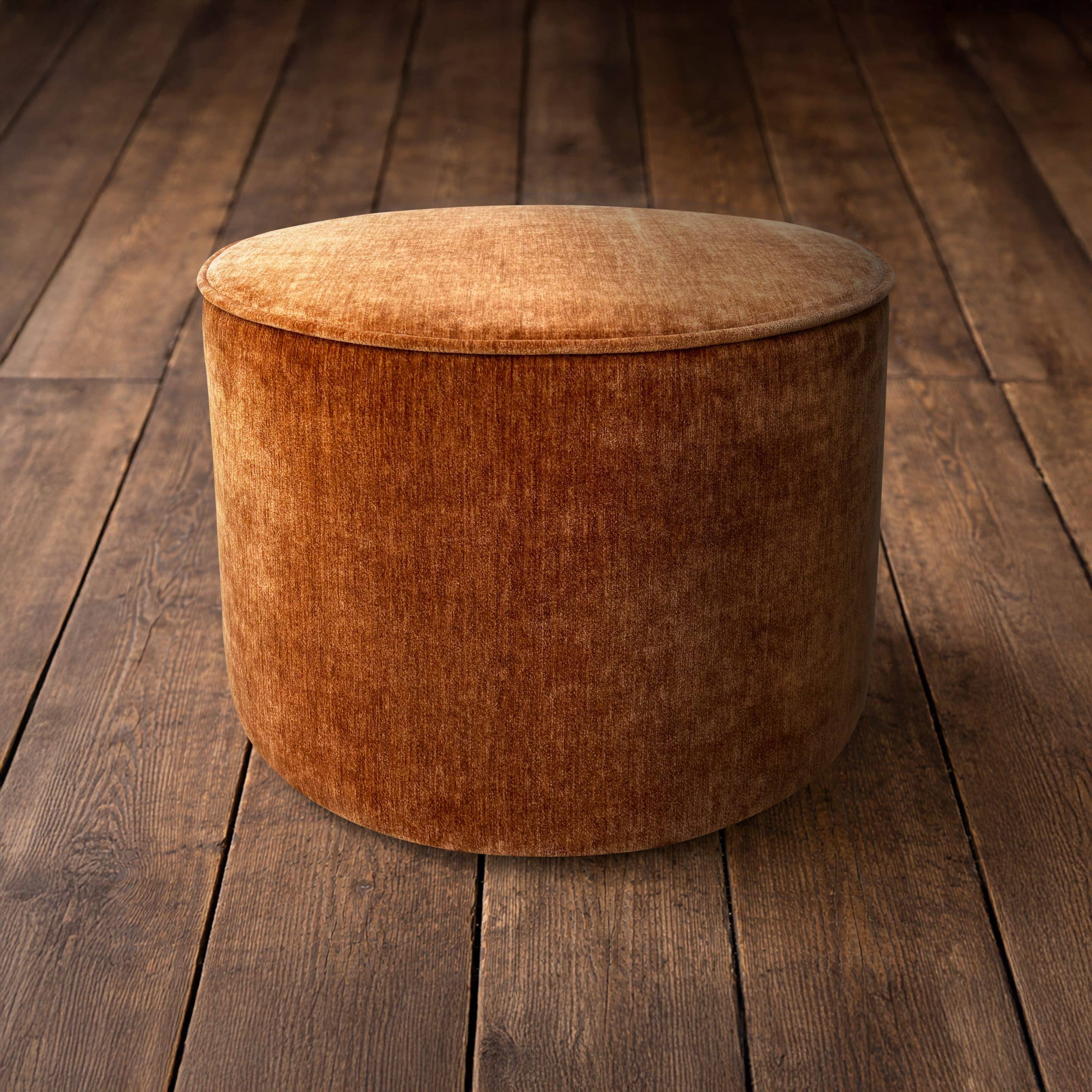 Copper Velvet Funky Copper velvet stool on wooden floorboards